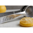 Mexican hand citrus juicer by Verve Culture with wooden handle and metal reamer for fresh juice extraction.
