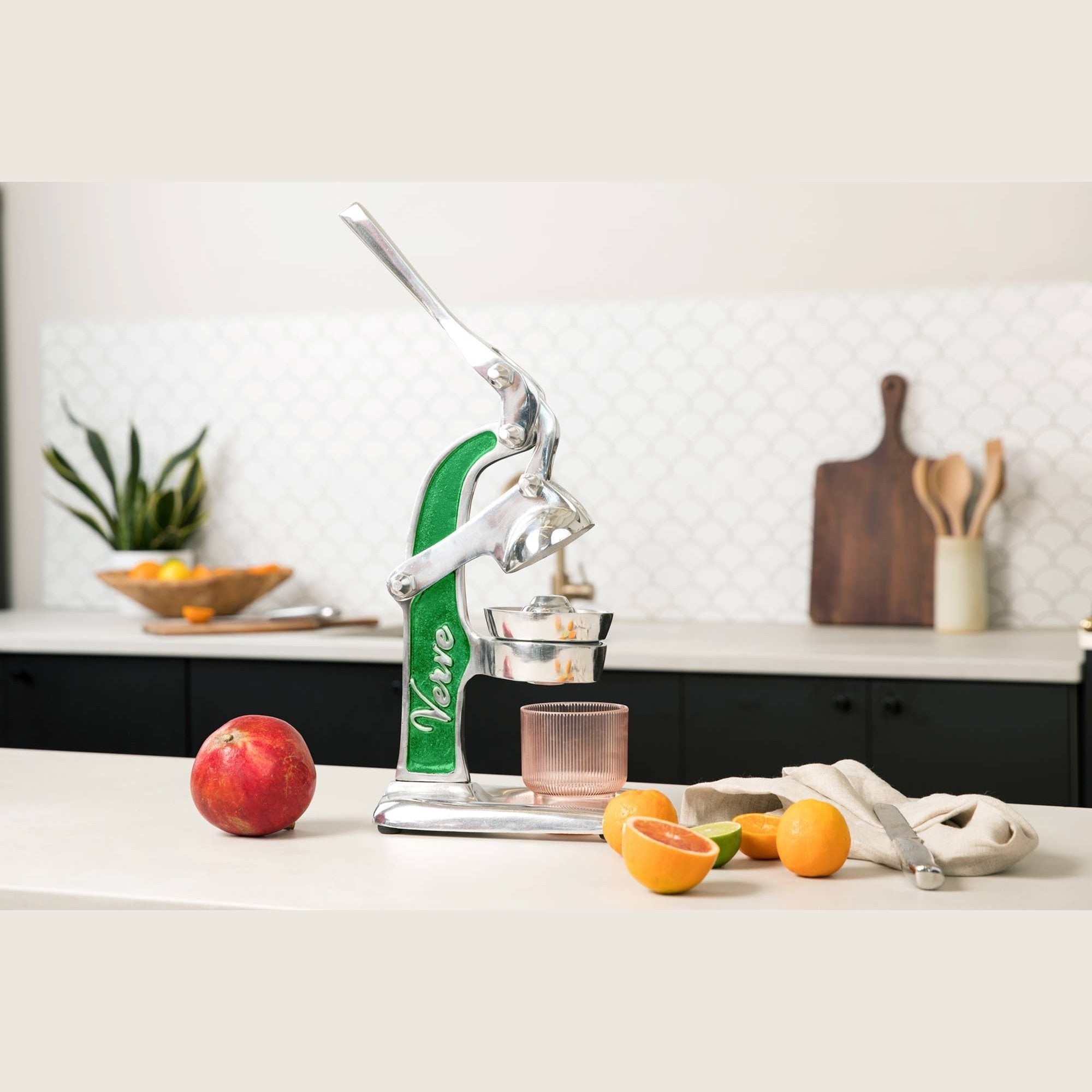 Green Verve Culture Mexican Citrus Juicer with a sturdy handle and cone for fresh juice extraction from oranges and limes.