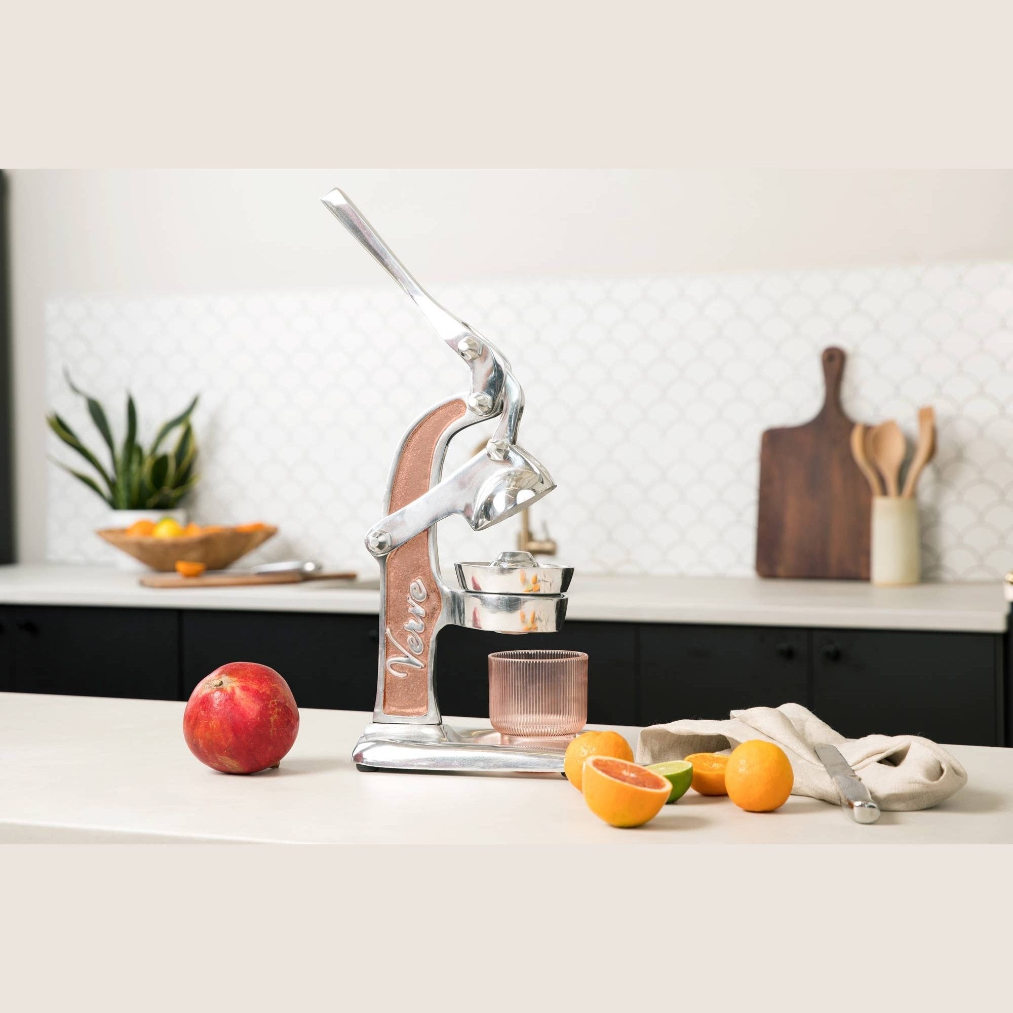 Green Mexican citrus juicer from Verve Culture with a traditional design for fresh juice extraction.