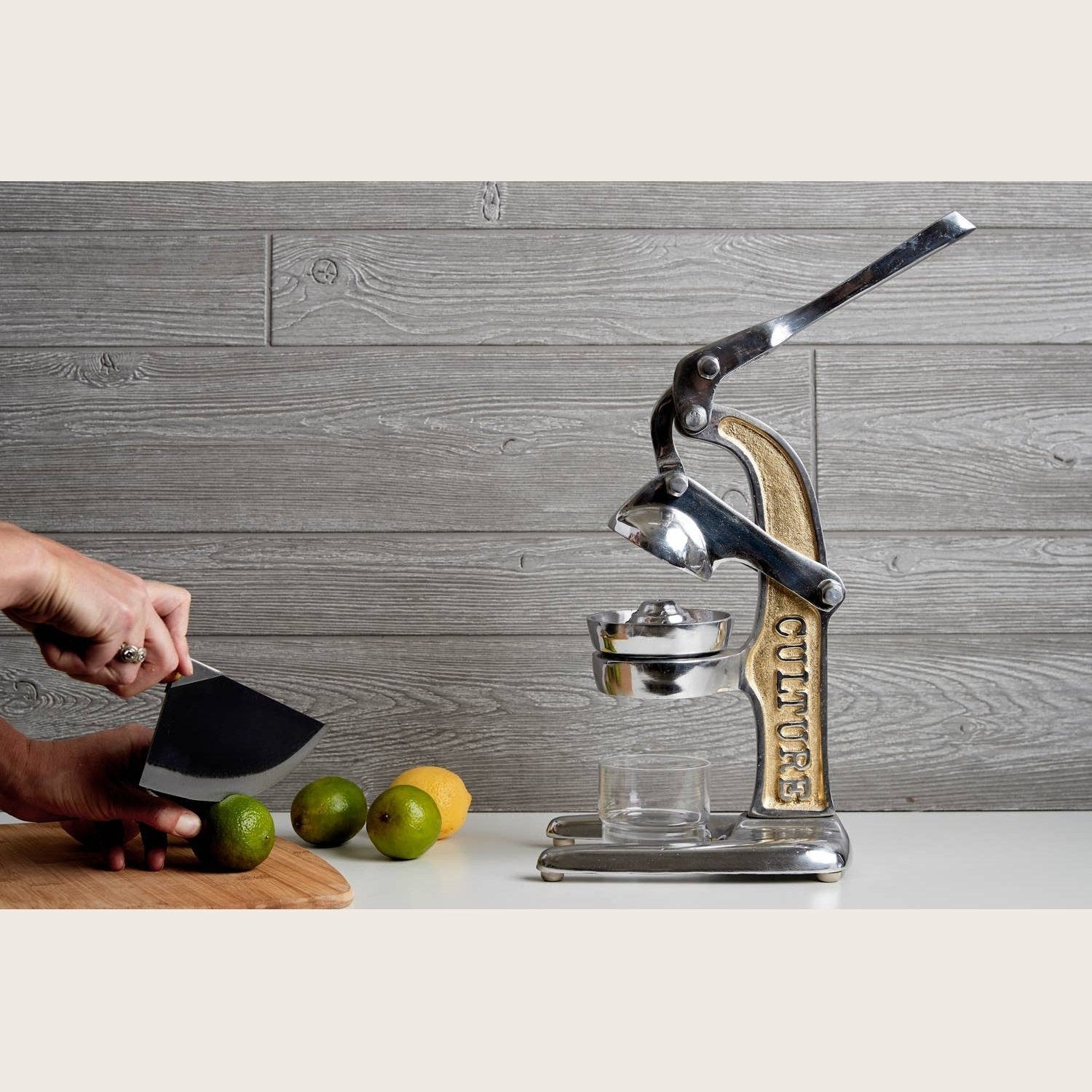 Green Mexican citrus juicer by Verve Culture with a sturdy handle and ridged reamer for fresh juice extraction.