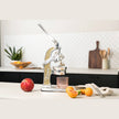 Green Mexican citrus juicer by Verve Culture with a sturdy handle and ridged design for easy juice extraction.