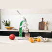 Green Mexican citrus juicer by Verve Culture, showcasing its traditional design for extracting fresh juice from oranges and limes.