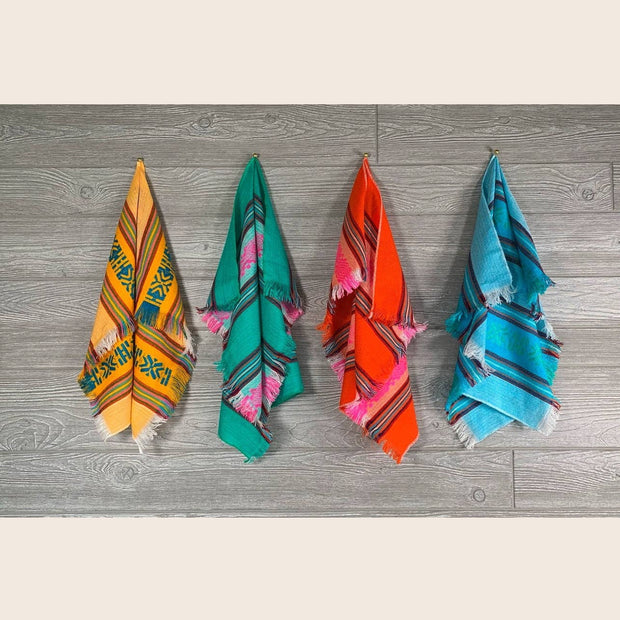 Set of four Mexican napkins by Verve Culture featuring vibrant traditional patterns and soft fabric.