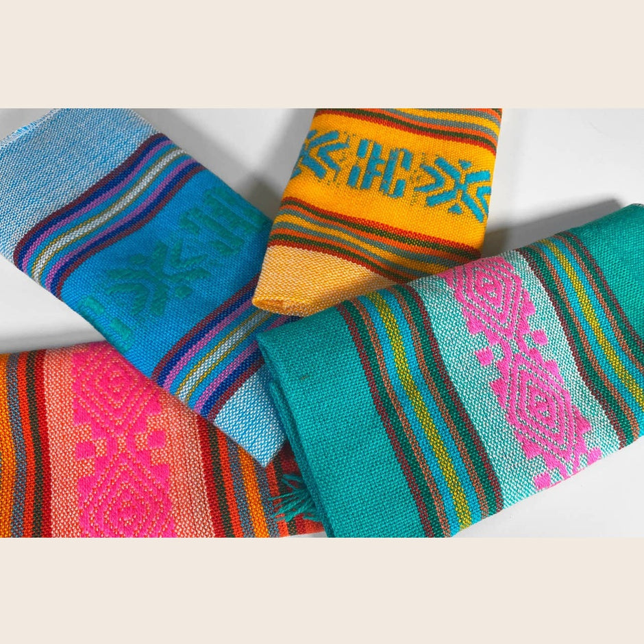 Set of four Mexican napkins by Verve Culture featuring vibrant traditional patterns and soft cotton fabric.