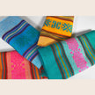 Set of four Mexican napkins by Verve Culture featuring vibrant traditional patterns and soft cotton fabric.