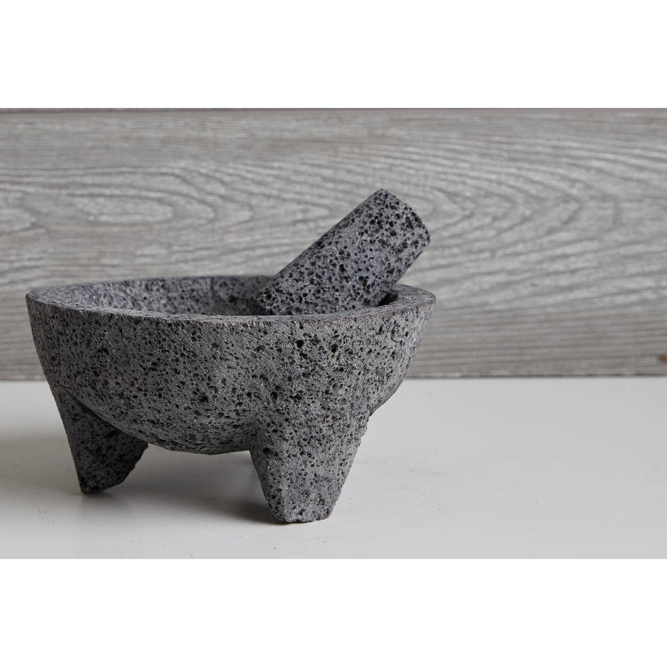 Verve Culture 7-inch molcajete with woven tortilla basket for authentic Mexican kitchen serving and preparation.