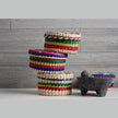 Verve Culture 7-inch molcajete with matching tortilla basket, traditional Mexican kitchenware for preparing and serving tortillas.