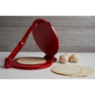 Cast iron tortilla press kit by Verve Culture showing a sturdy cast iron tortilla press with wooden handles on a wooden surface.