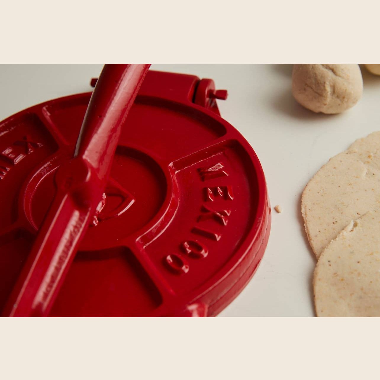 Cast iron tortilla press from Verve Culture with wooden handles, part of the tortilla press kit for authentic Mexican tortillas.