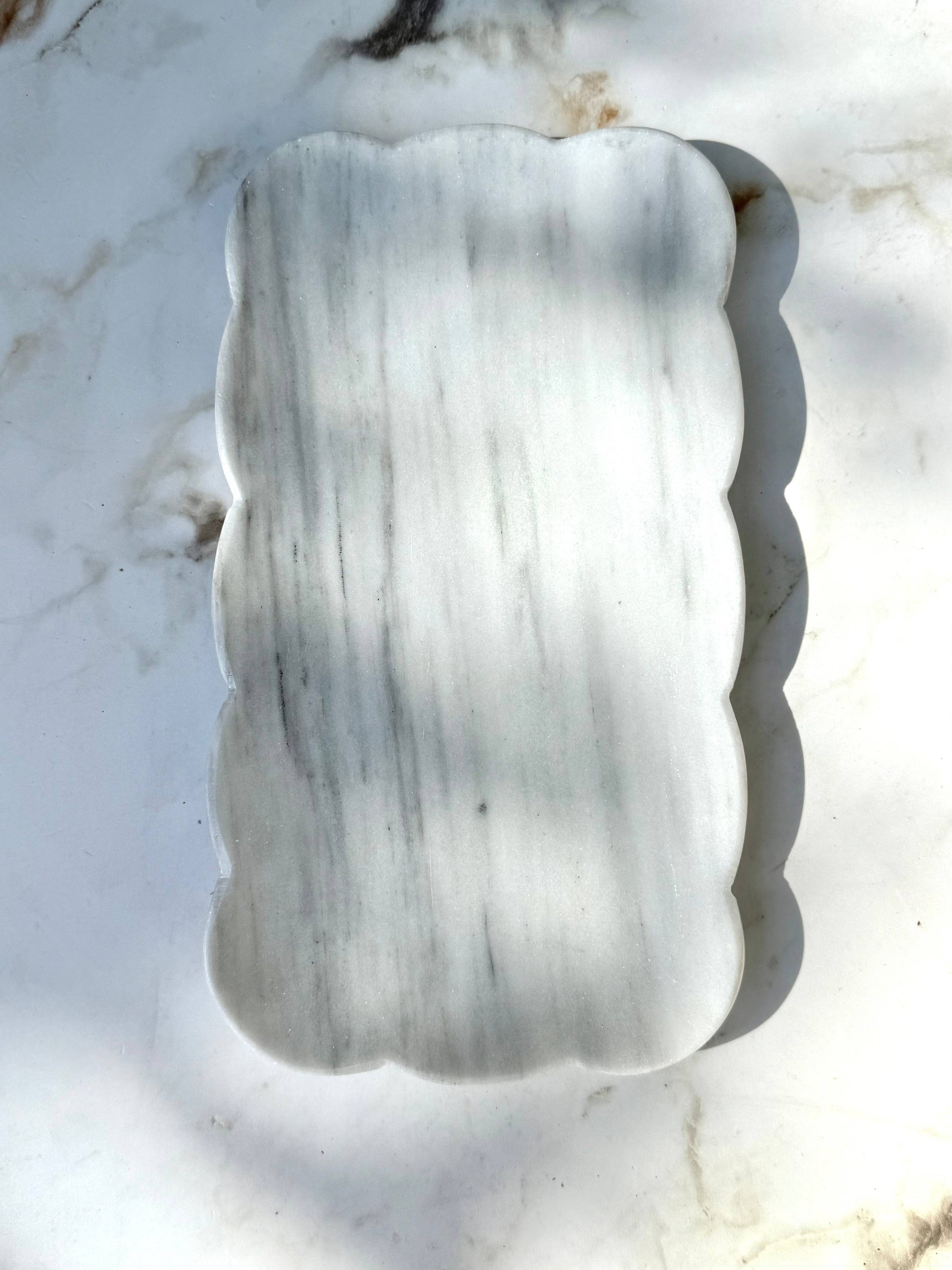 White Josaphine marble tray by Villa Lua Home, showcasing elegant rectangular marble surface with smooth edges and subtle veining.
