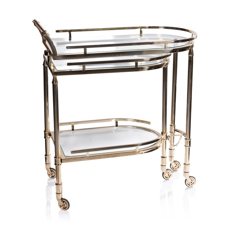 Zodax Spiga gold bar cart with sleek design, four wheels, and a spacious top surface for drinks and barware.
