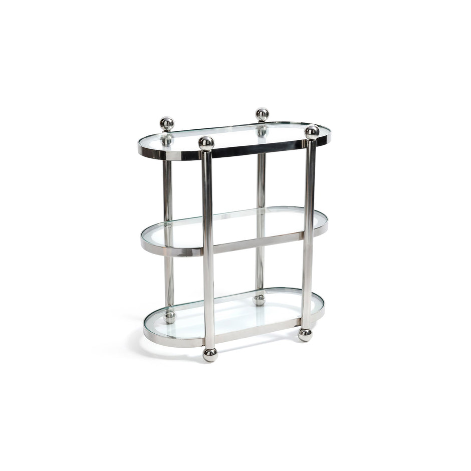 Polished chrome three-tier bookshelf by Zodax with open shelves for displaying books and decor items.