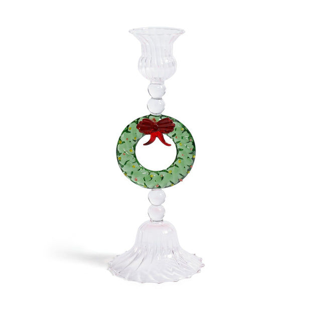 Zodax holiday wreath taper candle holder with festive greenery and red accents, designed to hold taper candles for holiday decor.