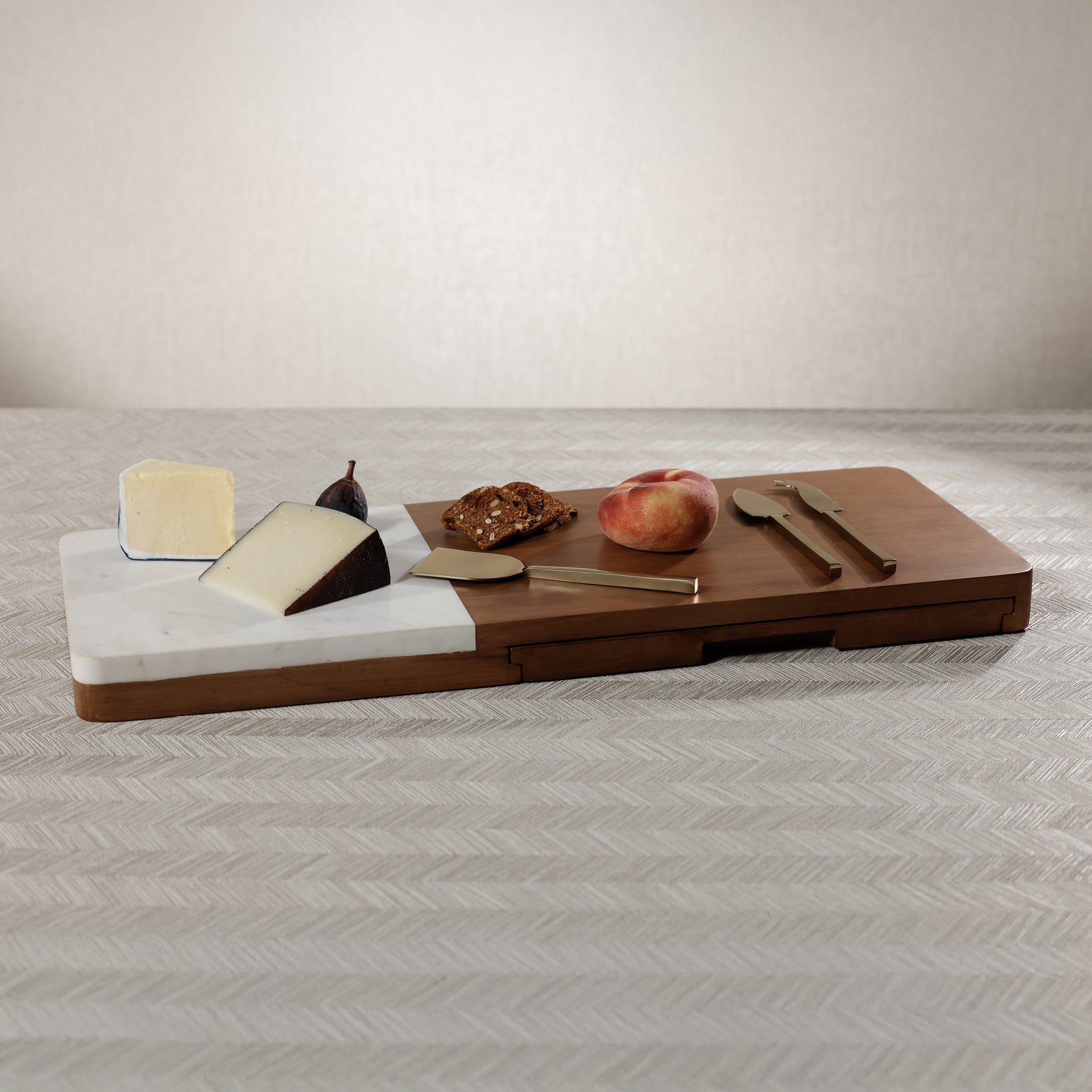 Marble and mango wood cheese and cutting board with tools, perfect for serving charcuterie and appetizers.