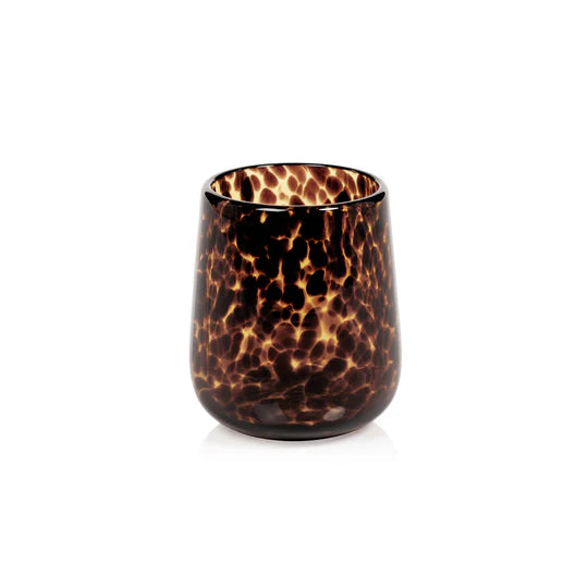 Stemless tortoise shell glassware by Zodax, showcasing a stylish, rounded glass with a tortoise shell pattern and smooth finish.